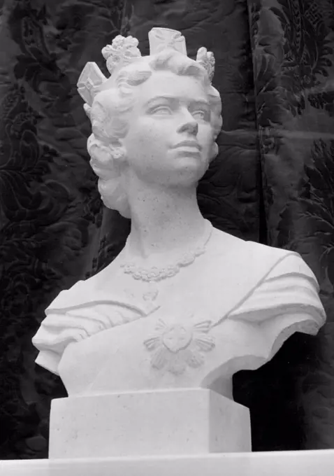 The Famous In Sculpture -- Bust of Her Majesty Queen Elizabeth II, in bianco del mare, by George H. Paulin, H.R.I., A.R.S.A., F.R.B.S. The Society of Portrait Sculptors are holding an Exhibition at the Imperial Institute, South Kensington, S.W. Many of the most famous sculptors are exhibiting. November 16, 1953. (Photo by Fox Photos).