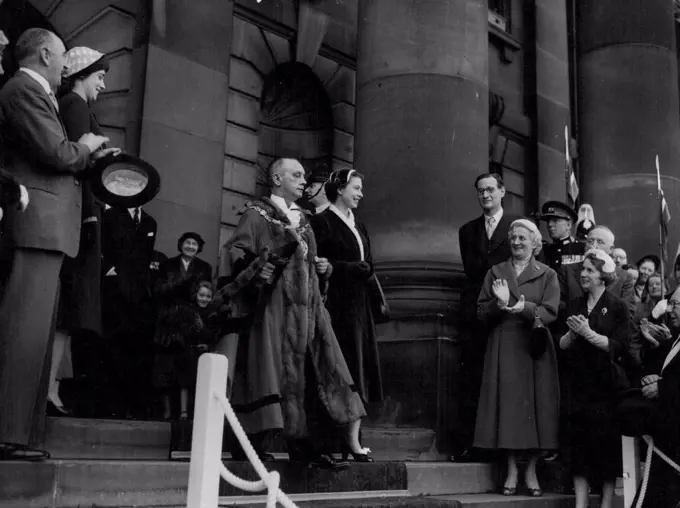 Royal Visit To Lancashire -- Councillor Bert Scott Mayor of Lancaster escorts the Queen from the Town Hall after her morning visit. April 13, 1955.