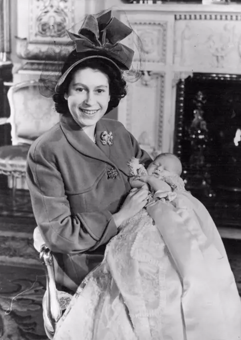 Royal Baby Christened - First First picture of Prince Charles here seen held in the arms of his mother, Princess Elizabeth - after the baby Prince was christened by Dr. Geoffrey Fisher, the Archbishop of Canterbury in a ceremony at Buckingham Palace. Named Charles Philip Arthur George. December 15, 1948. 