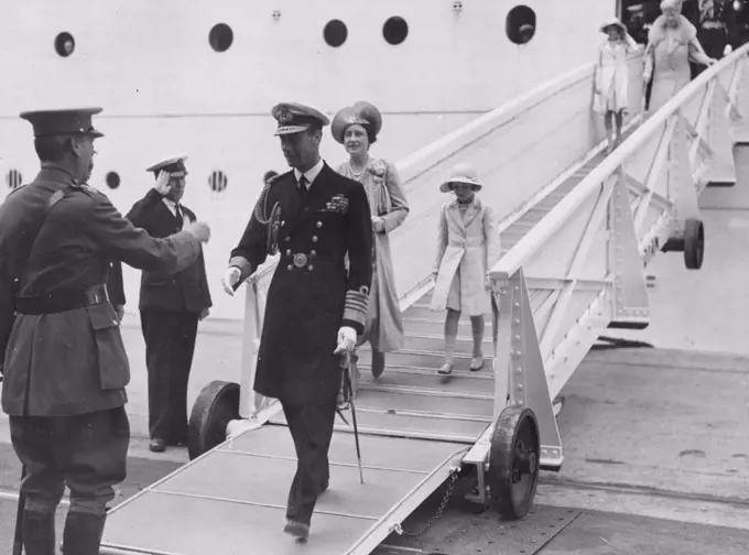 Royal Canadian Tour: Welcome Home -- Our photograph shows the arrival of Their Majesties at Southampton yesterday, June 22. The King is seen stepping ashore from the liner Empress of Britain and he about to shake hands with Lord Mottistone, Lord Lieutenant of Hampshire. The Queen and Princess Margaret are just behind, and Queen Mary and Princess Elizabeth can be seen at the top of the gangway. July 11, 1939. 