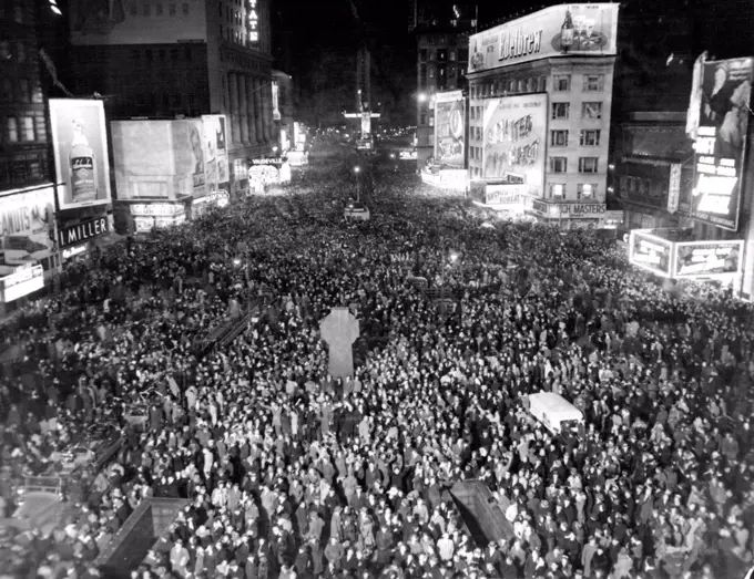Times Square Throng Hails New Year.This Picture of Jam-Packed Times Square in New York was made exactly at Midnight Dec.31 as New Yorkers Thronged the "White Way" to welcome 1946. The view is from 47th street and Broadway, looking south. January 1, 1946. (Photo by Associated Press Photo).