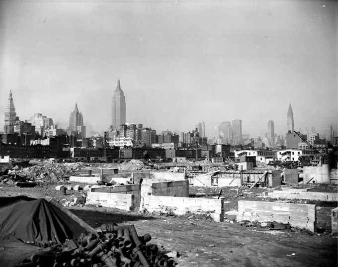 ***** center in the foreground, is the Empire state building. The tall, needle shaped structure at right is the Chrysler Building. April 2, 1947. (Photo by Wide World Photo).