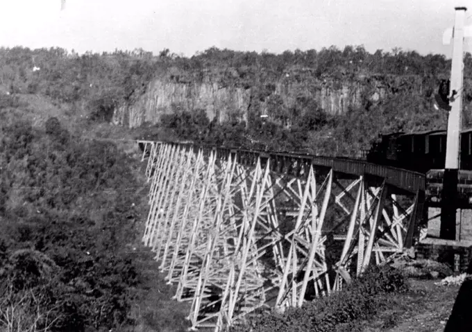Over The Chinese Frontier:The Approach From Burma.Our photograph shows the Gokteik Viaduct, on the way from Mandalay to Lashis, the railhead. At Gokteik "the staunch little train dragged itself across a railway viaduct alleged to be the highest in the world. In small stations perched among the mountains, posters hopefully adjured the tribesmen to X Visit Scarborough". July 7, 1938.