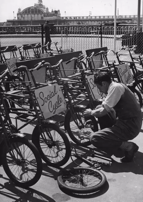 "Built for Two"Fares may go up in the London Area, but at Southend, two can ride for the price of one on these holiday "Social Cycles". Sometimes called Cuddle-bikes, the machines get double the attention of an ordinary cycle- they get double the weight toe. May 31, 1950. (Photo by Fox Photo).