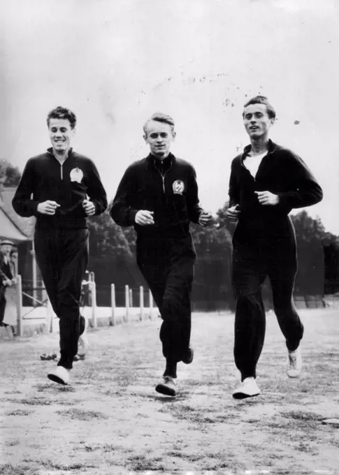 Hungary's record-breaking trio of Laszlo Tabori, Istvan Roszavolgyi and Sandor Iharos loosen up on grass. November 25, 1955. (Photo by Magyar Foto).
