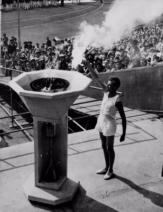 XIV Olympic Opens -- The mystery of the torchbearer who was to carry the final torch, ended when John Mark, a Cambridge Athletic blue arrived at the Wembley Stadim at 3.50 to perform the ceremony of lighting the Olympic Flame at the Opening of the 1948 Olympic Games. July 29, 1948. (Photo by Reuterphoto).