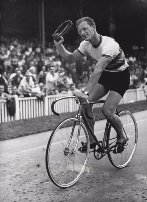 Mockridge making an honor lap after winning the Grand Prix de Paris.Russell Mockridge, Australia's greatest allround cyclist, was killed instantly today in his wife's sight.A motor bus ran over him in a race crash at North Clayton.His wife, Irene, and their daughter, aged two, were following the race.A wheel of the bus passed over Mockridge's head.Mrs. Mockridge leapt from a car, screaming, as she saw her husband lying on the road. August 11, 1952. (Photo by The Associated Press Ltd.).