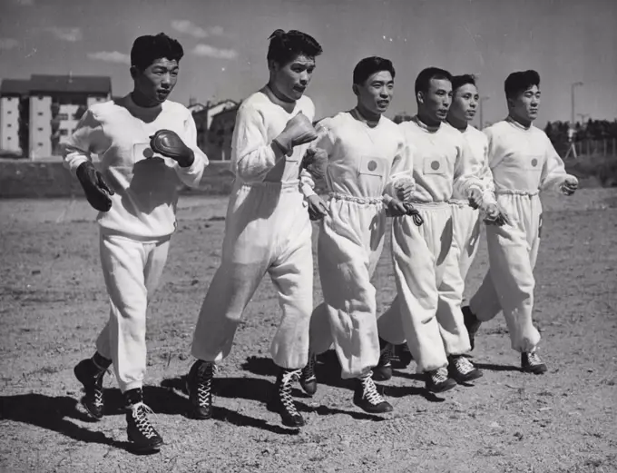 Japanese Fighting Men in Helsinki - Wrestlers and Boxers of the Japanese Olympic team set out on a training run together at the Olympic Village training ground, Helsinki, Finland, a few days ago.Left to right: Yoshitaro Nagato and Tohsihito Ishimaru (Boxers) and Yushu Kitano, Shohachi Ishii, Risaburo Tominga and Takeo Shimotori (Wrestlers). July 04, 1952. (Photo by Associated Press Photo).