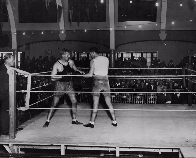 Phil Scott Getting Ready For Stribling - Phil Scott sparring with a Don Shortland in the Pier Pavilion at Herne Bay, in preparation for his fight with Young Stribling. Spectators attempt his practice the money going to charities. September 11, 1930. (Photo by Central Press Photograph).