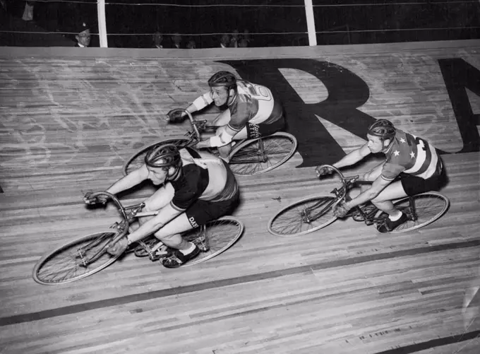 They Will Ride For Six Days -- Three of the riders in the international six-days cycle race at the Empire Pool, Wembley, early this morning. They are (left to right); Albert Bruylandt (Belgium); Ferdinando Terruzzi (Italy) and Alfred Strom (Australia).Film star Diana Dors started the £8,000 international six-days cycle race at the Empire pool, Wembley, at midnight (Sunday). There were 24 starters in this marathon, and by the time it ends on Saturday they will have covered over 1,600 miles. May 19, 1952. (Photo by Reuterphoto).