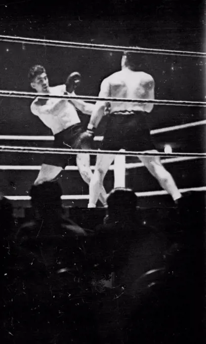 Loughran Beats Strickland At Wembley -- An incident during the fight between Tommy Loughran of America and Maurice Strickland of New Zealand, at the Empire Stadium, Wembley. Loughran was the winner on points. November 12, 1935. (Photo by Keystone).