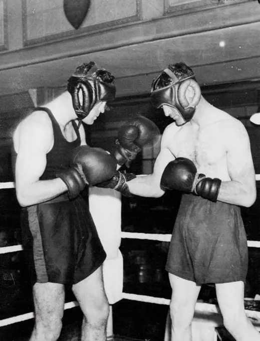 Strickland Prepares To Meet Loughran -- Maurice Strickland, the New Zealand champion (left) photographed sparring with Jeff Wilson, at the Stadium Club today. Strickland meets Tommy Loughran at Wembley next Tuesday. November 05, 1935. (Photo by Keystone).