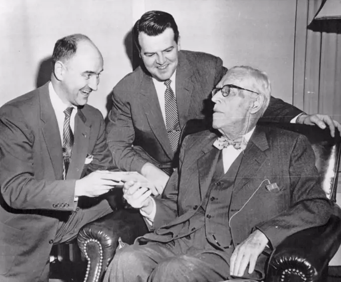 Outlives Insurance Policy -- William S. Spellman, seated, father of Francis Cardinal Spellman, receives a check representing full payment on his life insurance policy from Edward Livingston (left) and Charles H. Kerrigan, Union Central Life Insurance Co., representatives, here today. Insurance officials said the 96-year-old man has outlived the policy which happens only one time in 100,000. The amount of the check is several thousand dollars. November 15, 1954. (Photo by AP Wirephoto).