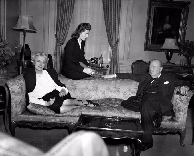 Churchills RelaxWinston Churchill, The former Prime Minister of Great Britain His wife and daughter, Mrs. Sarah Oliver, enjoy a moment of relaxation in their suite at the Waldorf - Astoria here. Since Their Arrival in The U.S. for a vacation, The Churchills have followed a Gruelling schedule of travel and sight - seeing dinners and speeches. This occasion was just prior to their departure for England. March 21, 1946.