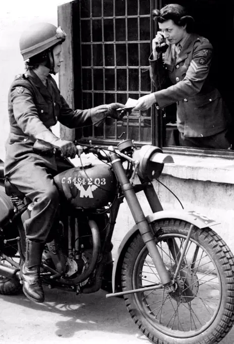A.T.S. Girls who want to go to France - An A.T.S. dispatch rider who will serve overseas, receiving a dispatch from an H.Q. orderly.Thousands of A.T.S. girls are now in training to serve with the Invasion Troops. Their training includes studies in French for administration work in civil affairs and general knowledge of the countries to which they will be sent. They come from many walks in life and all are eager for overseas service. June 29, 1944.