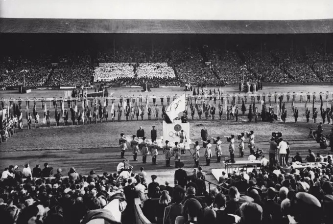Closing Of The Games Of The XIV Olympiad: A general view of the Closing of the Games of the XIV Olympiad at Wembley Stadium, London, August 14th. At foreground, State Trumpeters sound a Fanfare. Seen on the Tribune of Honour is Sir Frederick Wells, Lord Mayor of London. (Obscured by flag is Sigfrid Edstrom, President of the International Olympic Committee). Standing on the right of Tribune is Lord Burghley, Chairman of the Organising Committee. Behind the Tribune are paraded the flags of the competing nations. August 14, 1948. (Photo by Reuterphoto).
