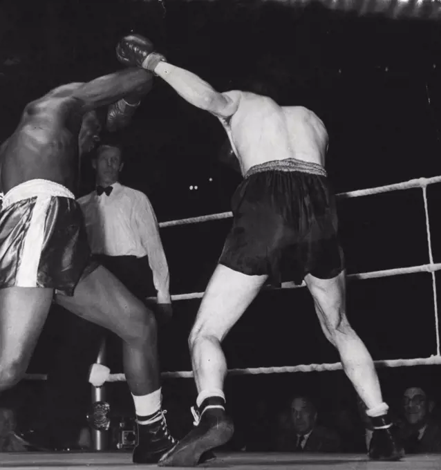 Boxing at Albert Hall - Ollie Williams, of West Ham (right) and Ben Lokko of the Gold Coast, seen during their contest which Lokko won by a K.O. at Albert Hall last night. May 14, 1952.