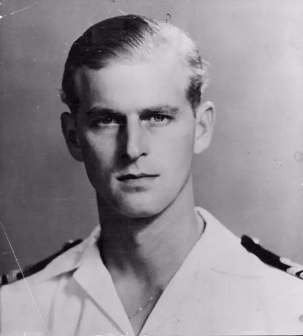 Young Man of the Moment: A recent Picture of Lt. Philip Mountbatten, R.N., formerly Prince Philip of Greece. An official statement regarding reports of the betrothal of H.R.H. Princess Elizabeth to the former Prince is expected from Buckingham Palace within the next day or so. Here Lt. Mountbatten is seen in tropical uniform of the Royal Navy. He joined the senior service as a midshipman at 19, and served at the Battle of Matapan in HMS Valiant. July 09, 1947.