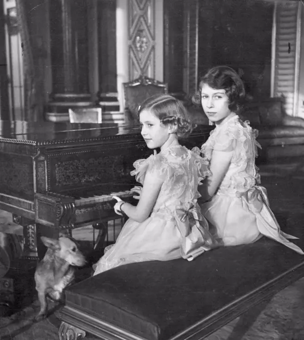 Princesses Elizabeth and Margaret Rose in Buckingham Palace. July 1, 1953. (Photo by Marcus Adams).