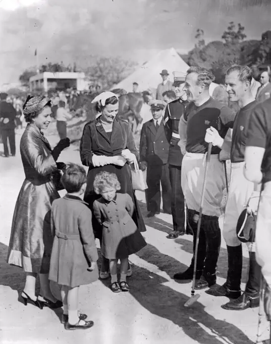 Thrill of the day for Prince Charles and Princess Anne a chat with Daddy and Uncle Dickie (Earl Mountbetten) at the Marsa polo ground, Malta. In the centre is Lady Mountbatten. With the Queen, the children had seen the Duke and Lord Mountbatten playing polo for the Navy against the Army The Navy won 4-2.Polo Match. Homeward bound after his Commonwealth tour with the Queen the Duke of Edinburgh took part in a Navy Army polo match at Malta. Navy won 4-2. Here the Royal children, accompanied by the Queen and Lady Mountbatten, were taken to see their father and Uncle Dickie (Earl Mountbatten) before the match began. Princess Anne seems more interested in something else. May 6, 1954. (Photo by Daily Mirror).