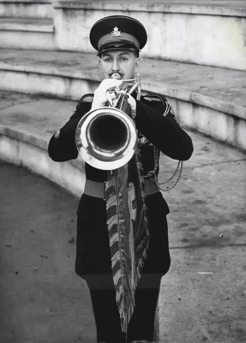 Coronation 'Solo' -- Waxed moustaches peak about his trumpet as student bandmaster A. Parker of Belfast sounds a fanfare at Kneller Hall - the Army musicians school at Twickenham, Middlesex, where trumpeters are training for Coronation duties in Westminster Abbey. January 29, 1953. (Photo by Reuterphoto).