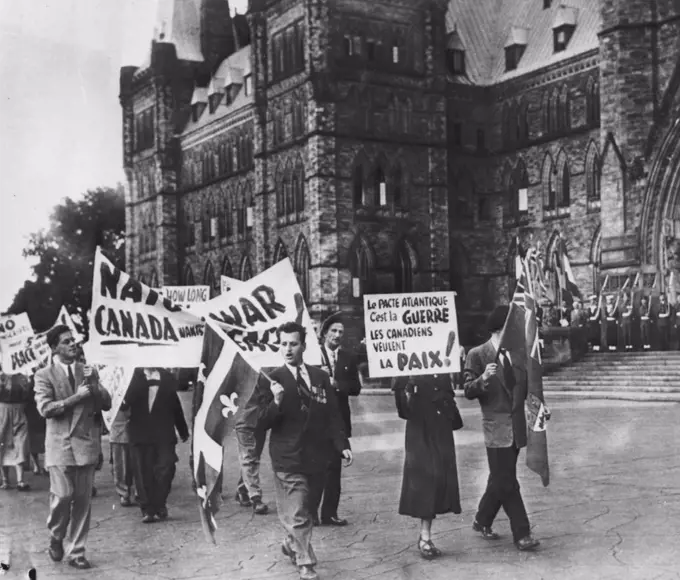 Picketing Nato Opening - ***** parade in front of the Parliament building ***** afternoon protesting the North Atlantic peace pact ***** Some pickets shouted, "Yanaks Go Home" and "We ***** Want War". September 15, 1951. (Photo by AP Wirephoto).