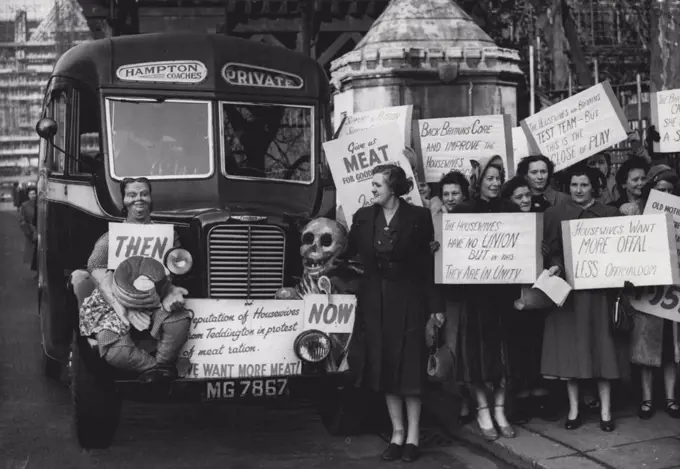 Housewives Ignor Steel - Protest About Meat - Steel and a motion of censure were before the House of Commons, but these Teddington (Middlesex) housewives travelled down by motor-coach to present petitions against 'The meat position'. Decorating their coach were a dummy representing the plump pre-war housewife and a skull with the post-war meat ration (what the housewives forget - the home was due to debate Meat to-marrow). Britain: "In no country do dissenting voices find a platform so easily." Above, protesting housewives. February 7, 1951. (Photo by Reuterphoto).