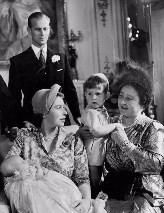 The Christening of Princess Anne - Princess Anne, the second child of H.R.H. Princess Elizabeth and the Duke of Edinburgh, was christened at Buckingham Palace on October 21st, 1950. H.M. The Queen, holding Prince Charles, talks to H.R.H. Princess Elizabeth Who has Princess Anne in her arms. Standing behind is H.R.H. the Duke of Edinburgh. November 08, 1950. (Photo by Baron, Camera Press).