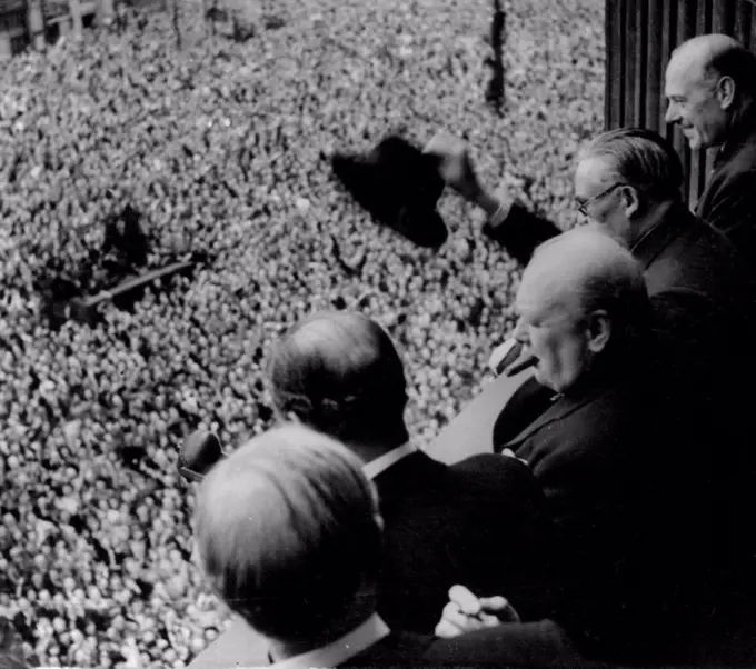 The P.M. and a section of the huge crowd.Ve day Prime Minister addresses Whitehall crowd. From a balcony in the ministry of health building in Whitehall Mr.Churchill addresses a huge crowd. members of the Cabinet were with him on the balcony. June 04, 1945. (Photo by Sport & General Press Agency Limited).