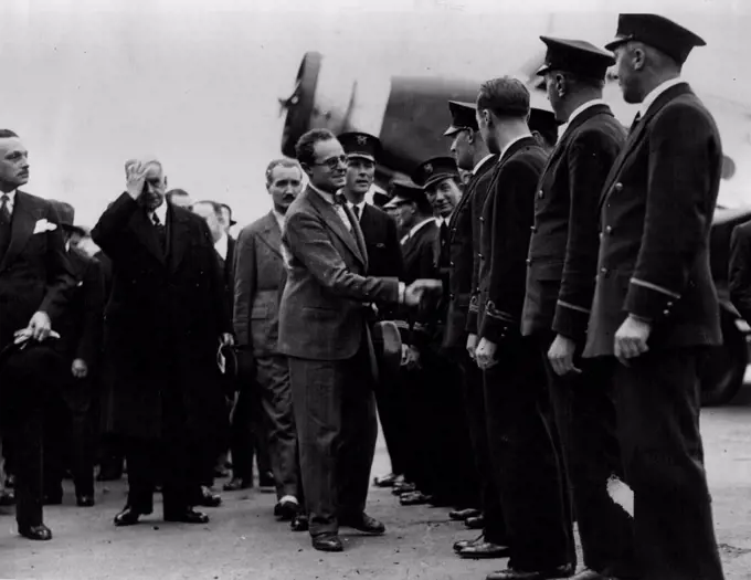 French Air Minister Inaugurates Great New Air LineM. Pierre Cot shaking hands with the pilots of the new line.All the French air lines have now been grouped together into one big concern called Air France. The new organization was brought into being at a ceremony over which M. Pierre Cot, French Minister for Air, presided. October 09, 1933.
