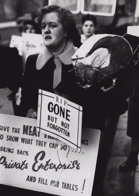 Meat Ration Protest...... Miss Olive D'Oyle a 38yr old Teddington butcher carried a paper mache 'joint' in a car board coffin en route for speakers corner in Hyde Park where she led a meat ration protest meeting. February 26, 1951. (Photo by Daily Mail Contract Picture).
