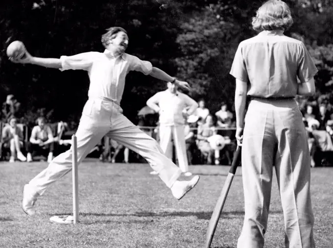 Cricket Match Between Authors and Actresses.A.P. Herbert Bowling. Standing At the Wicket is Miss C. Stewart.The annual cricket match between authors and actresses took place today in Aid of the St. Pancras house improvement Society at West Wing, Outer Circle, Regent's Park. July 25, 1939. (Photo by Keystone).