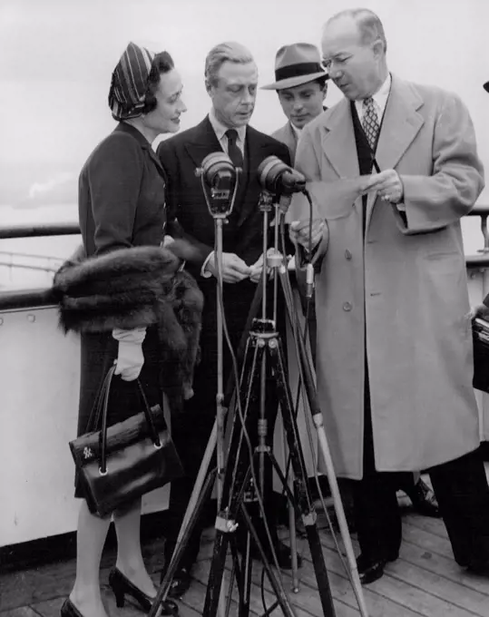 The Windsors' Hello to the U.S.A.The Duke and Duchess of Windsor go through the script of a greeting broadcast to the U.S.A. on the deck of the "Queen Elizabeth" before docking in New York Harbour. November 14, 1946.