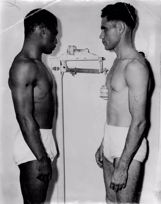 Photograph ***** day's stadium ***** emphasises difference height between Jack Hassen and Tommy Stenhouse. February 07, 1949.