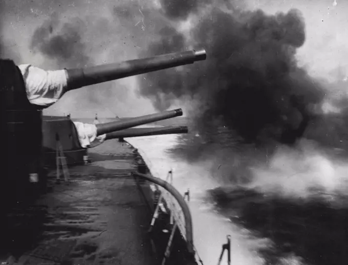 British Fleet Maneuvers In The Atlantic - The 15inch guns of H.M.S. Hood being fired.The combined Home and Mediterranean Fleets are now carrying out their spring maneuvers in the North Atlantic. Calm weather has followed the gales and rough seas which the fleet at first experienced. May 01, 1934. (Photo by Keystone).