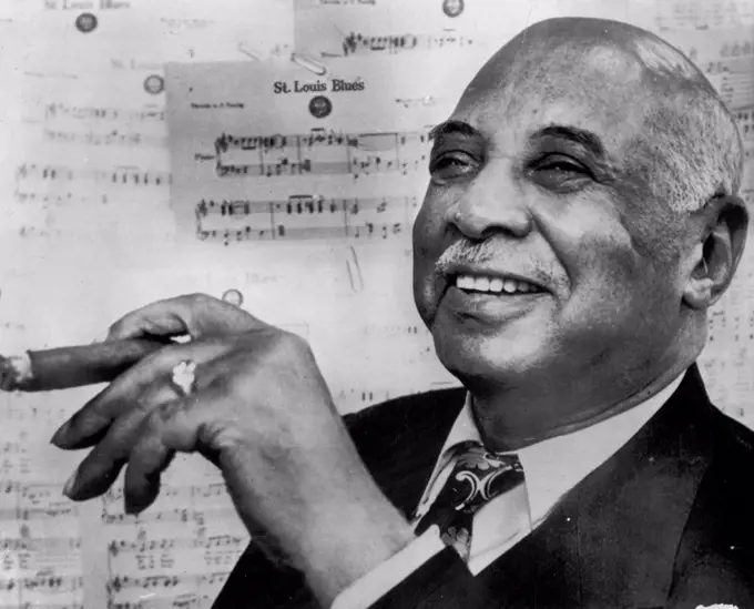 'Mr. Blues' Is 78-W. C. Handy, often called "father of the blues" relaxes in his publishing office here on the eve of his 78th birthday. The composer of such hits as "St. Louis Blues," Memphis Blues," and others will be feted tonight by friends at the Waldorf Astoria. Now partially blind, the famed cornetist now spends most of his time promoting the W. C. Handy foundation for the Blind. W. C. Handy, acknowledged "father of the blues," composed such jazz hits as "St. Louis Blues" and "Memphis Blues." His life story has been filmed.November 16, 1951. (Photo by AP Wirephoto). 