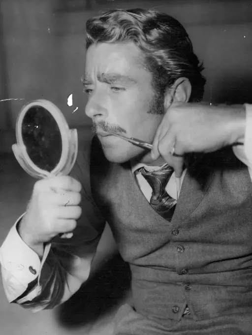 Peter Lawford who takes part of "Connor" in the Fox picture "Kangaroo" trimming his moustache while waiting his cue. November 13, 1950. (Photo by Thompson/Fairfax Media).