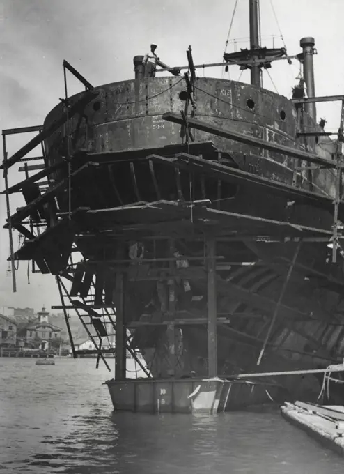Evidence of the skill of Australian ship repairers is given in the above pictures. Left: The stern of a ship which was damaged by a torpedo some months ago. Right: The same ship with repairs nearly completed. A coffer dam was fitted around the stern of the vessel, leaving a dry dock free for other work. January 8, 1943.