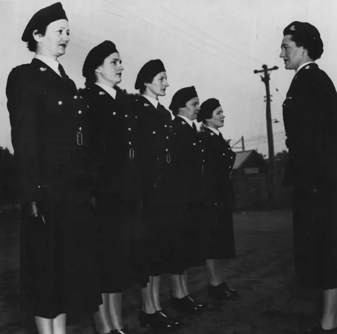 First Full-Dress -- Parade today of members of the Women's Auxiliary Army Corps in their smart new green uniforms. These girls will leave for Canberra this afternoon to take part in the Jubilee opening of *****. June 14, 1951.