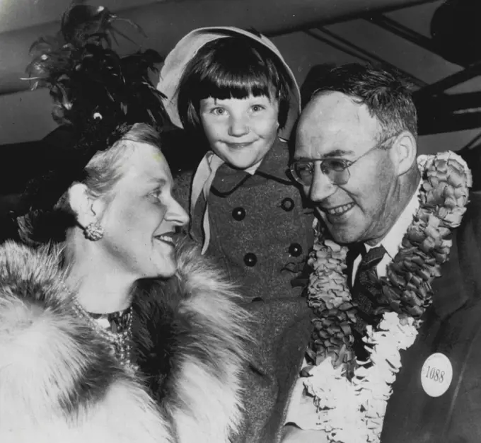 War Bride Arrives After Six Year Wait -- Ex-GI Cecil Yeadon of Salt Lake City, his Australian war bride, Claris, and their five year old daughter, Arymine, are all smiles as the wife and daughter arrived here tonight from Australia. It took Yeadon several years to overcome Government regulations and red tape to get them here. January 12, 1951. (Photo by AP Wirephoto).