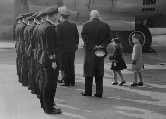 The Princess Is Home -- Little Princess Anne is tip-toe with excitement and Prince Charles is obviously admiring the uniforms of the pilots as H.R.H. Princess Margaret shakes hands with the crew of the Stratocruiser Canopus after landing at London Airport today.H.R.H. Princess Margaret today arrived home after her Caribbean Tour. The Royal Children went with H.M. The Queen H.R.H. The Duke of Edinburgh and the Queen Mother to great the Princess at London Airport. March 03, 1955. (Photo by Fox Photos).