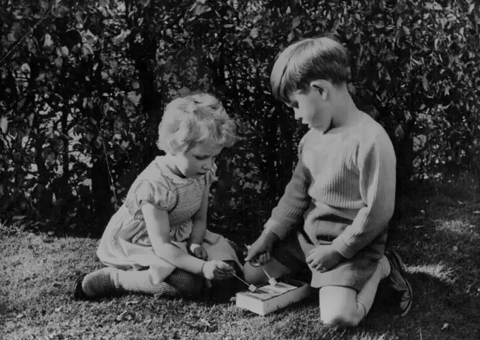Royal Musicians -- Hitherto unpublished picture shows Prince Charles and Princess Anne playing with their tiny xylophone at Royal Lodge, Windsor. August 23, 1954. (Photo by Paul Popper; Paul Popper Ltd.).