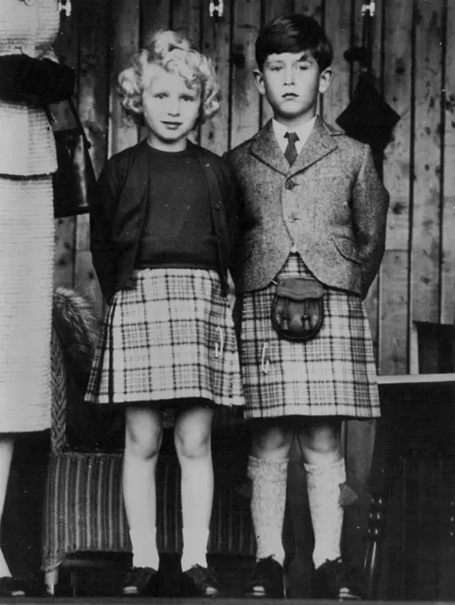 Britain's royal children, Princess Anne, left, and her brother, Prince Charles, dressed in appropriate kilts watch the Braemar games, in Scotland. September 09, 1955.