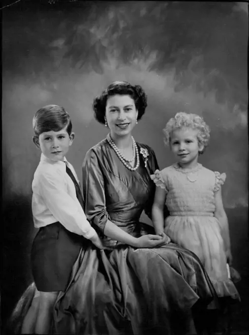 H.M. The Queen With H.R.H. Prince Charles And H.R.H. Princess Anne.A new and charming study of her majesty, with T.R.H.'s Prince Charles and Princess Anne. December 26, 1954. (Photo by Marcus Adams, The London Electrotype Agency Ltd.).