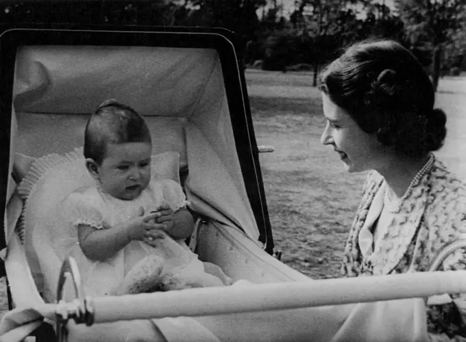 A charming study of Princess Elizabeth and Prince Charles at their delightful Surrey home. October 13, 1949. (Photo by British News Reels).