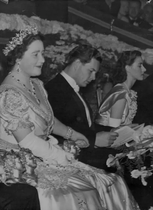 Left to Right, in the Royal box, during the performance, November 25, are: Queen Elizabeth; King Michael of Rumania; and Princess Margaret. The King and Queen accompanied by Princess Margaret, attended a royal command film performance, at the Odeon Theatre, Leicester Square, London, last night, November 25. The performance which also was attended by the queen of Denmark and the king of Rumania, was in aid of hte Cinematograph Trade Benevolent fund. November 26, 1947.