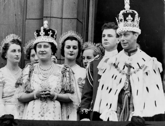 King And Queen Receive The Homage Of Their Subjects -- The King and Queen, still in their ermine robes, and Crowns, photographed on the balcony of Buckingham Palace this evening, when they were acclaimed by tremendous crowds. May 12, 1937. (Photo by Keystone).