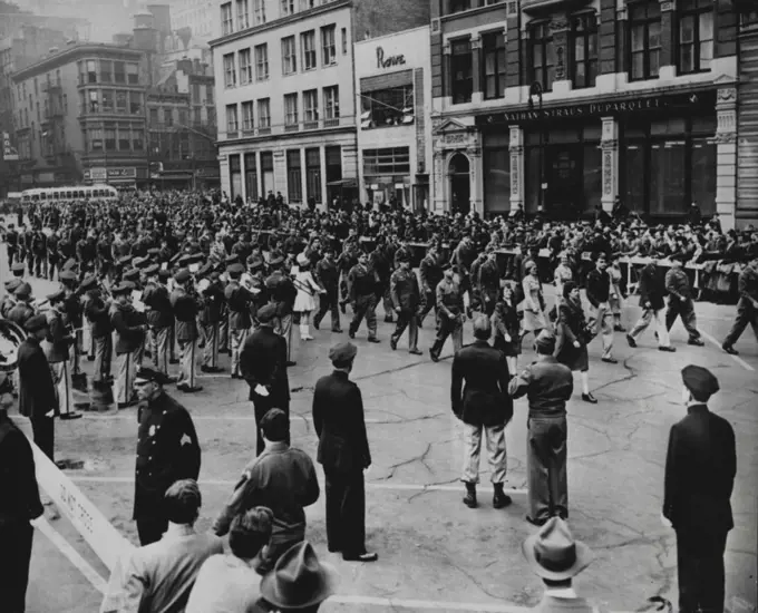 Participate In May Day Parade -- Men and women in service uniform march through Union Square, New York City, May 1, in the May Day parade. Rep. J. Parnell Thomas (R-NJ), chairman of the House committee on Unamerican Activities, in Washington, D.C., May 3, declared a number of Army officers and men took part in a "tresonable demonstration" by marching in the parade. May 3, 1947. (Photo by Associated Press Photo).