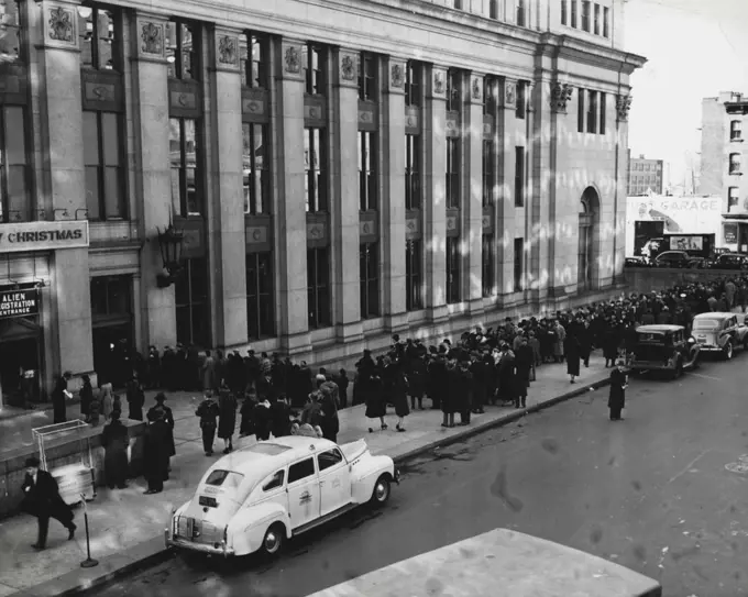 New York Aliens Rush To Register -- Aliens lined up outside the New York City General post office Monday, to beat the deadline for Alien registration, which ends Thursday, Dec. 26. December 23, 1940. (Photo by ACME).