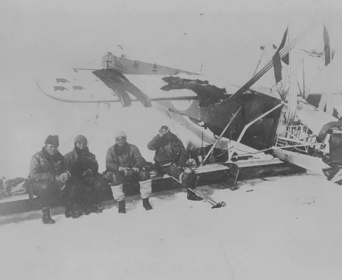 The Nobile Crew In Their Famous Red Tent! -- The most isolated people in the world - the survivors of the Nobile disaster, living in the red tent on the ice-floe. Left to right: Professor Behounek, Biagi, Viglieri, and the injured Cecioni, on the extreme right. July 31, 1928. (Photo by Pacific & Atlantic Photos).